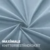 A close-up swirl of light blue fabric with text overlay. Produktbild-Vorschau