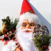 A close-up of a Santa Claus doll with Christmas decorations. Náhľad obrázku produktu
