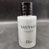 A white bottle of Dior Sauvage aftershave balm with a black cap. Produktbild-Vorschau