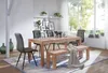 A dining room scene with a wooden table and chairs. Anteprima dell’immagine prodotto