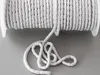 A spool of white weighted cord for curtains or drapes. Produktbild-Vorschau