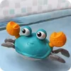 A toy crab floating in water, likely a bathtub or pool. Produktbild-Vorschau