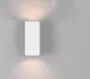 A white rectangular wall light fixture mounted on a gray wall, emitting light upwards and downwards. Produktbild-Vorschau