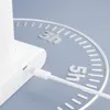 A close-up of a white device being charged, with a circular graphic indicating time durations. Produktbild-Vorschau