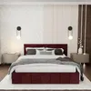 A bedroom scene featuring a large, upholstered bed. Produktbild-Vorschau