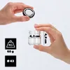 Hands holding a small glass jar and its lid, with dimensions and weight indicated. Podgląd zdjęcia produktu