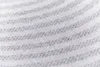A close-up view of a striped fabric texture. Produktbild-Vorschau