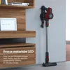 A cordless vacuum cleaner is mounted on a wall next to a wooden shelf unit. Voir les images du produit