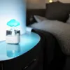 A mushroom-shaped humidifier with blue light sits on a nightstand next to a bed. Náhled obrázku produktu