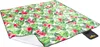 A picnic blanket with a floral pattern is laid out. Náhled obrázku produktu