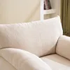 A close-up view of a beige upholstered armchair, showing the texture of the fabric and the armrest. Produktbild-Vorschau