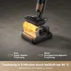 A close-up marketing image of a vacuum cleaner's cleaning head with glowing orange heat waves indicating a drying function. Produktbild-Vorschau
