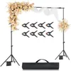 A wedding arch setup with floral decorations, fabric drapes, and photography clamps, displayed on a white background. Náhľad obrázku produktu