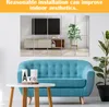 A living room scene with a blue sofa, a coffee table, and decorative wall mirrors reflecting a TV and a plant. Produktbild-Vorschau