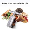 A pollen press tool surrounded by various spices and herbs. Produktbild-Vorschau