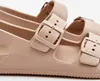 A close-up view of a beige sandal with buckles. Produktbild-Vorschau