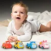 A baby is lying on a white blanket with four toy cars in front of them. Produktbild-Vorschau