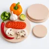 A collection of fresh vegetables and mushrooms arranged on wooden cutting boards. Podgląd zdjęcia produktu