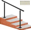 A black metal handrail installed on a set of outdoor stairs with brick risers and concrete treads. Several metal anchors are shown in the upper right corner. Anteprima dell’immagine prodotto