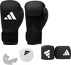 A set of boxing equipment including gloves, hand wraps, and a mouthguard, all branded with the Adidas logo. Produktbild-Vorschau