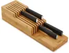 A bamboo knife organizer with several knives stored inside, shown on a white background. Náhled obrázku produktu