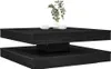 A black, two-tiered coffee table with a modern design, decorated with a vase of greenery and two cups and saucers. Náhľad obrázku produktu