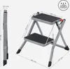 A folded and unfolded two-step ladder with dimensions indicated. Produktbild-Vorschau