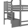 A close-up view of a gray wooden bunk bed with stairs and storage compartments. Produktbild-Vorschau