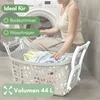 A woman is putting laundry into a washing machine, with a laundry basket in the foreground. Produktbild-Vorschau