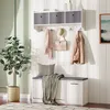 A hallway or entryway with a white wall-mounted shelf unit, a bench, and a plant. Voir les images du produit