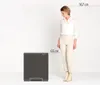 A woman stands next to a trash can, with dimensions indicated. Náhľad obrázku produktu