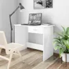 A white desk with a laptop, books, and a lamp in a room with wooden flooring and a plant. Podgląd zdjęcia produktu