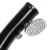 A close-up of a black solar shower with a silver showerhead and a small gauge attached. Produktbild-Vorschau
