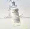 A bottle of Anua Heartleaf 77% Soothing Toner is shown partially submerged in water with splashes. Náhľad obrázku produktu