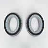 Two gray ear pads for headphones are shown against a white background. Podgląd zdjęcia produktu