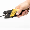 A hand holding a yellow and black wire stripper tool against a white background. Anteprima dell’immagine prodotto