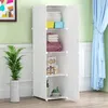 A white modular storage unit with shelves is shown indoors, next to a green wall and blue curtains. A potted plant is on the left. Anteprima dell’immagine prodotto