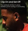 A close-up profile of a man wearing earbuds while outdoors. Voir les images du produit