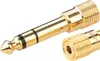 A close-up studio shot of a gold audio adapter. Podgląd zdjęcia produktu