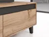Close-up view of a wooden cabinet with a black accent and black legs. Voir les images du produit