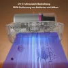 A close-up view of a handheld vacuum cleaner emitting UV-C light onto microscopic particles, illustrating its germ-killing capabilities. Produktbild-Vorschau