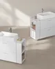 Two white bathroom vanities with sinks and open shelving. Náhled obrázku produktu