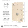 A climbing wall with climbing holds attached, shown with dimensions and included accessories listed. Voir les images du produit