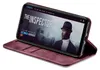 A smartphone in a burgundy flip case is displayed on a white background, showing a movie poster on its screen. Produktbild-Vorschau