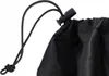 Close-up of a black drawstring bag closure with a cord lock. Náhľad obrázku produktu