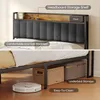 A bed frame with a headboard storage shelf and underbed storage, shown with a robot vacuum cleaner. Náhled obrázku produktu