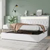 A white upholstered bed with LED lighting in the headboard, a brown throw blanket draped over the mattress, and storage space underneath. Náhľad obrázku produktu