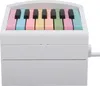A white musical instrument with colorful piano keys. Produktbild-Vorschau