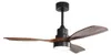 A black ceiling fan with brown wooden blades and a white LED light. Produktbild-Vorschau