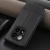 A black leather phone case with a camera cutout is shown on a dark surface with textured fabric in the background. Produktbild-Vorschau